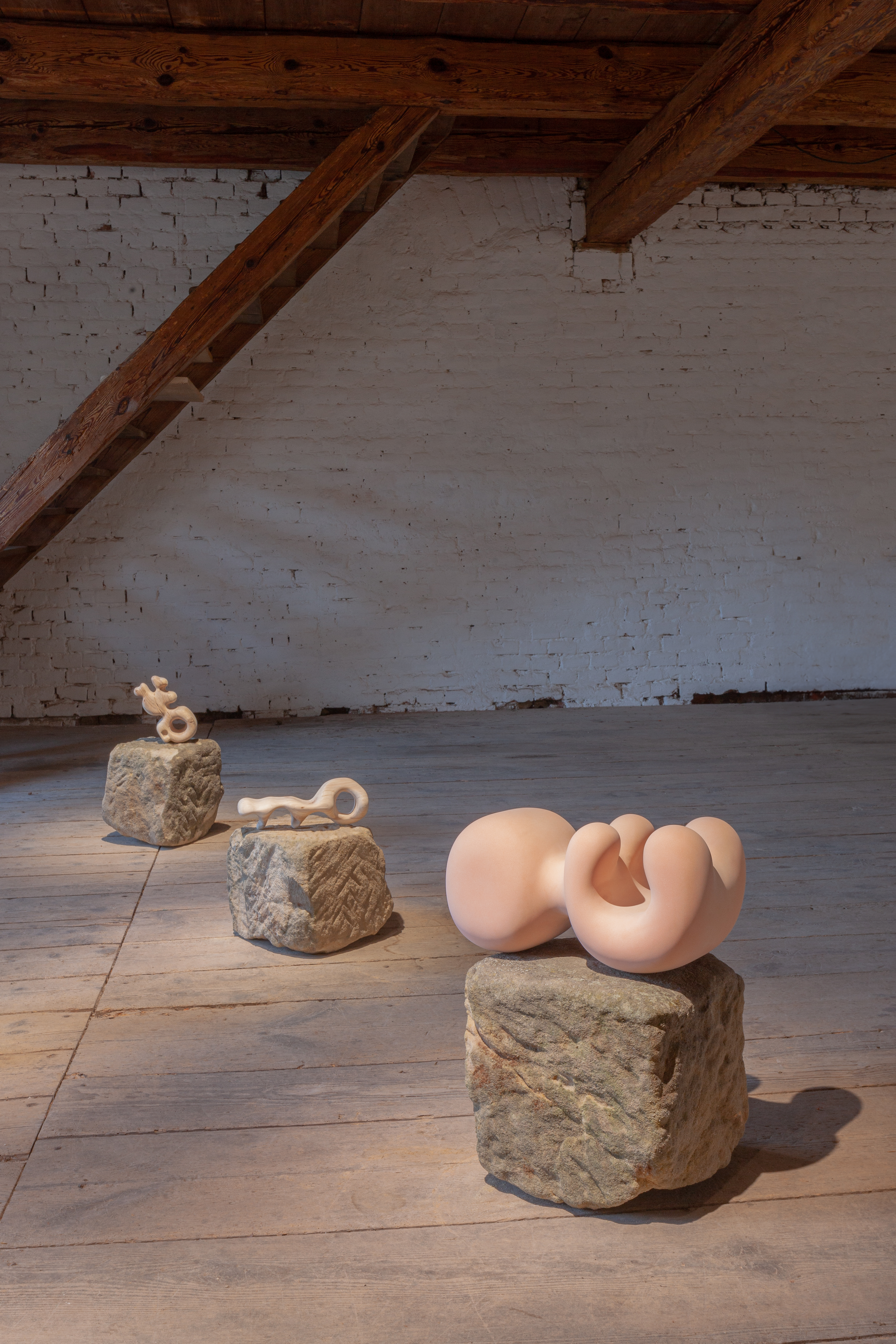 Photo of an art installation called Hands (and Other Products of Labor) 2.0 by Klára Čermáková (Farmstudio Open, Bohemia Farmstudio, Vysoká, Czechia) [Detail no. 2]. A detailed look at three of the sculptures/objects.
