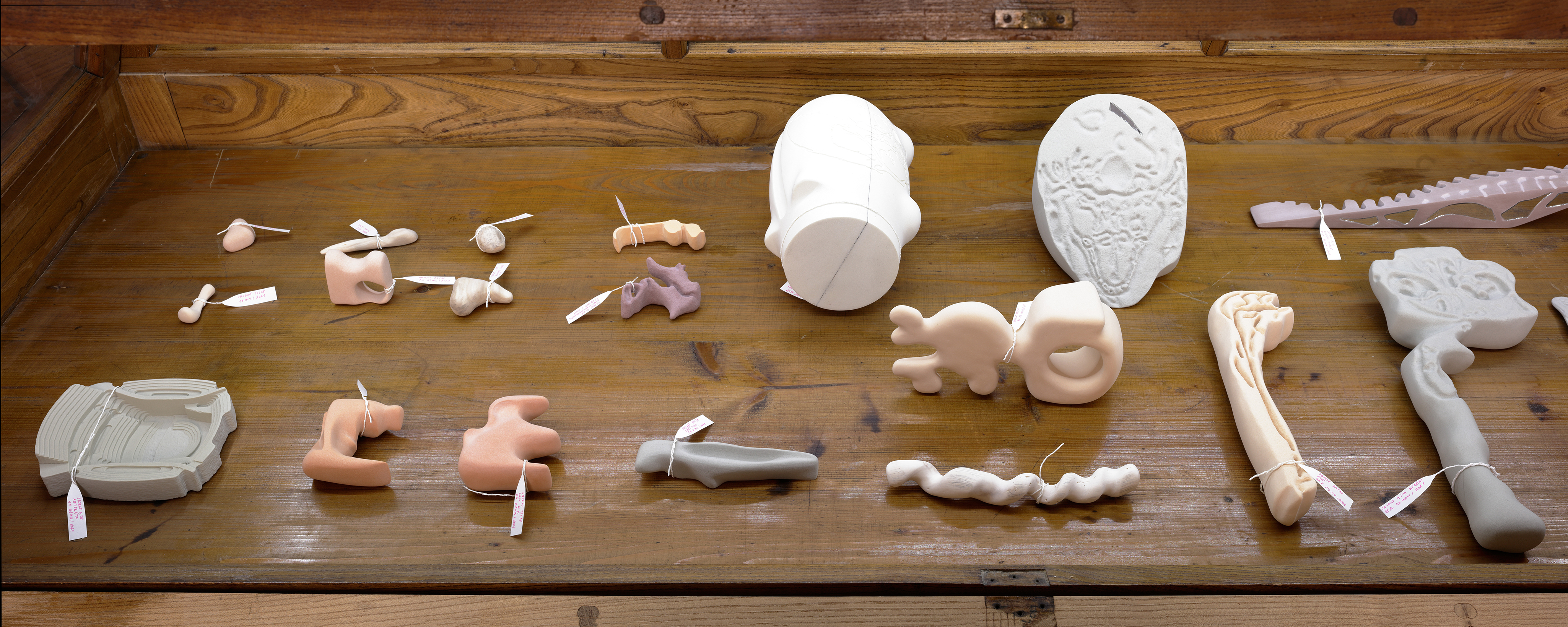 Photo of an art installation called Hands (and Other Products of Labor) 2.0 by Klára Čermáková (Mikulov Art Symposium, Mikulov, Czechia, 2021) [Detail no. 4]. A detailed look at the art objects in one of the “coffins.”