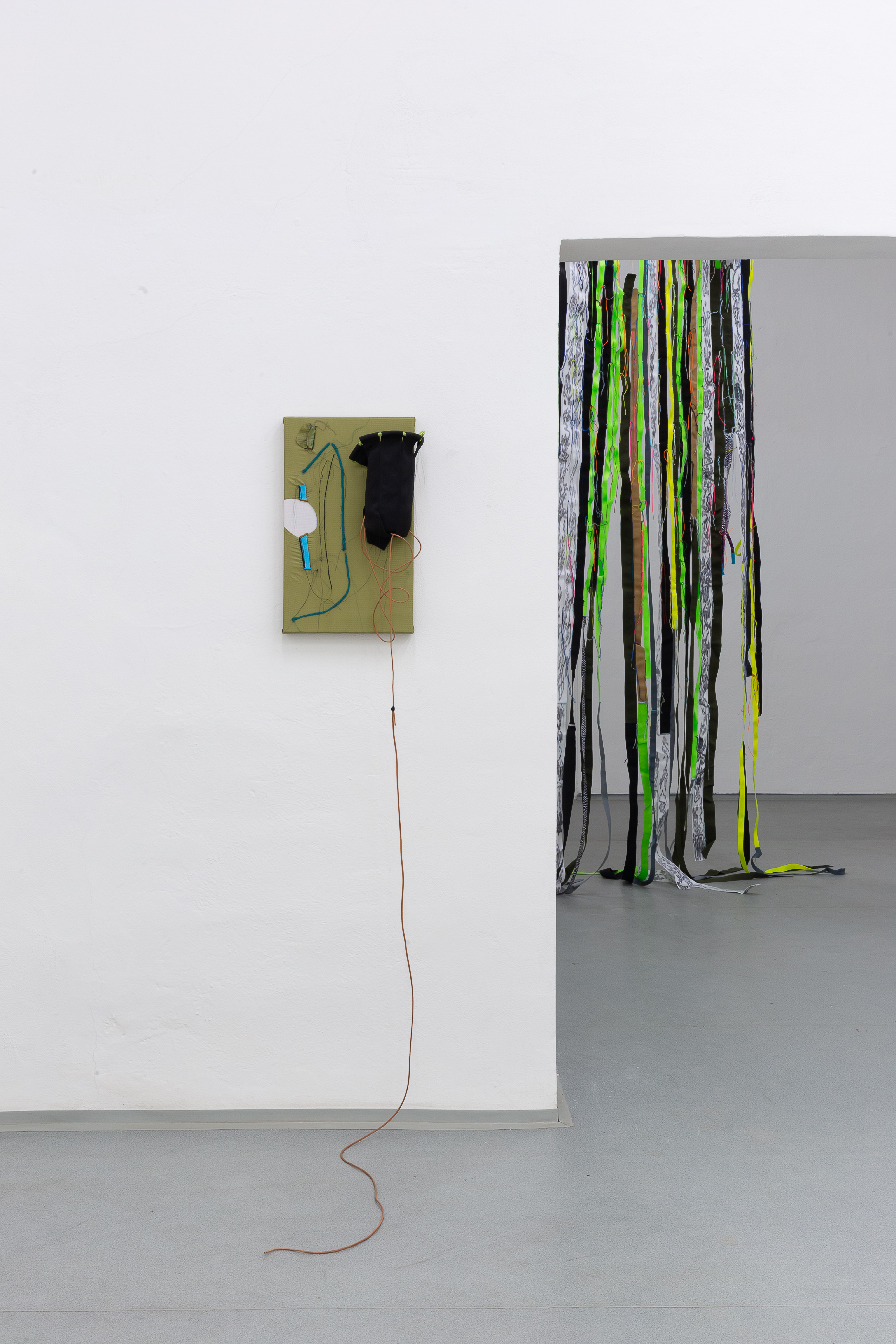Photo of an art installation called Hands (and Other Products of Labor) 2.0 by Klára Čermáková (Mikulov Art Symposium, Mikulov, Czechia, 2021) [Detail no. 2]. Another detailed view of one of the stitched paintings.